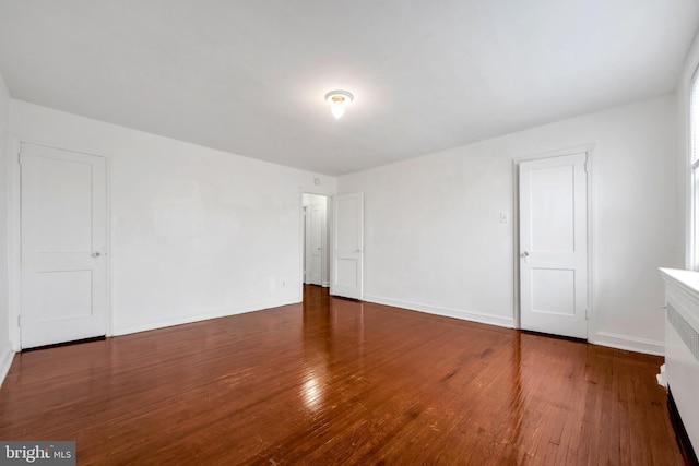 6846 Radbourne Rd, Upper Darby, PA 19082 - unfurnished room with baseboards and wood-type flooring