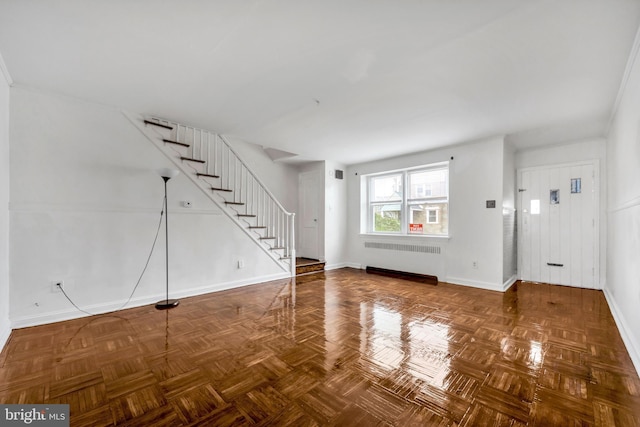 6846 Radbourne Rd, Upper Darby, PA 19082 - unfurnished living room featuring radiator, baseboards, and stairway