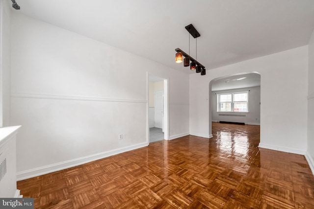 6846 Radbourne Rd, Upper Darby, PA 19082 - spare room featuring baseboards and arched walkways