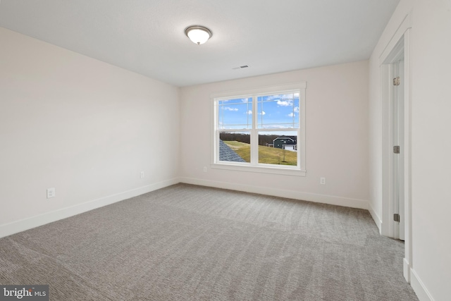 interior space featuring carpet flooring, visible vents, and baseboards