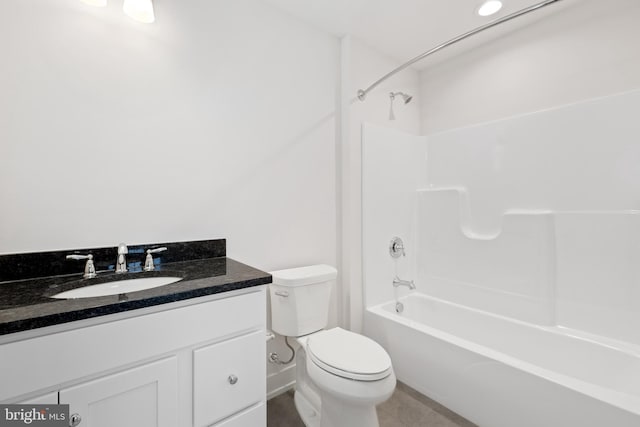 full bath featuring toilet, tile patterned floors, vanity, and bathtub / shower combination