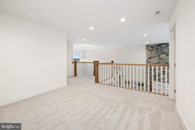 unfurnished room with carpet, visible vents, baseboards, a chandelier, and recessed lighting
