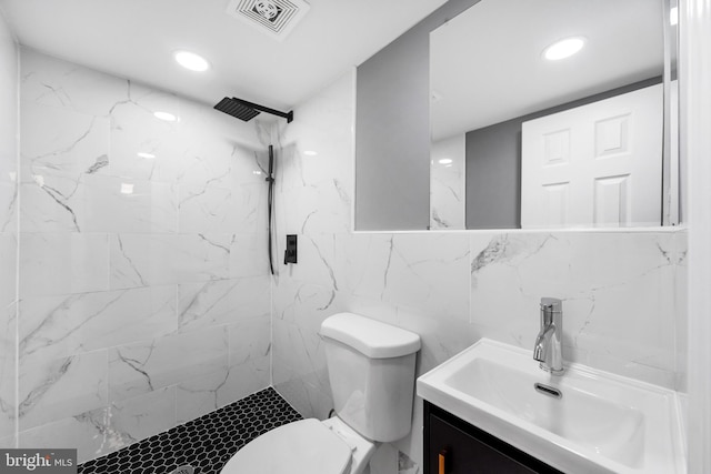 full bath featuring vanity, a marble finish shower, recessed lighting, toilet, and visible vents
