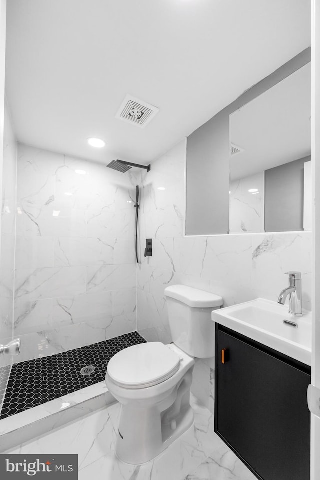 full bath with a marble finish shower, marble finish floor, visible vents, and toilet