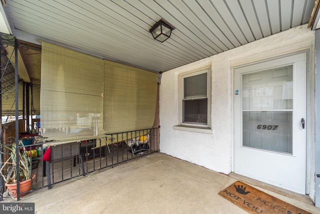 doorway to property with stucco siding