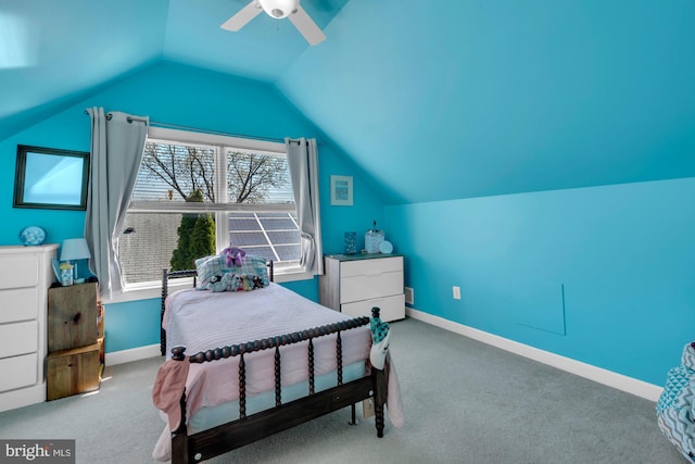 carpeted bedroom featuring ceiling fan, baseboards, and lofted ceiling