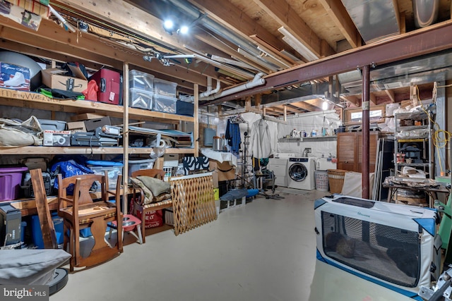 storage room featuring washer and clothes dryer