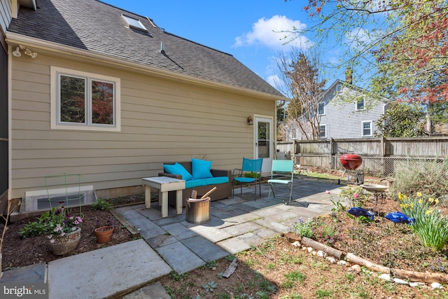 view of patio / terrace featuring an outdoor living space and fence