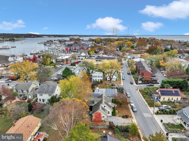 drone / aerial view with a water view and a residential view