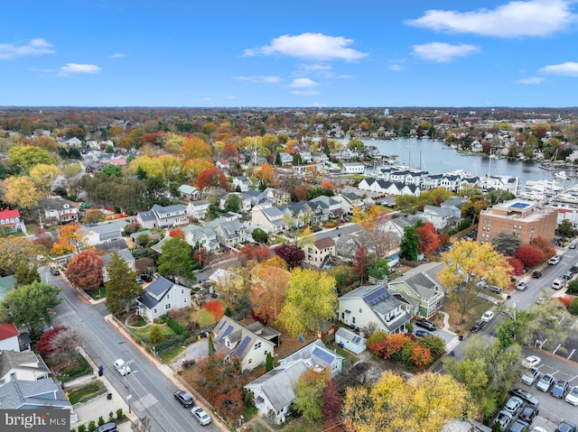 birds eye view of property featuring a water view and a residential view
