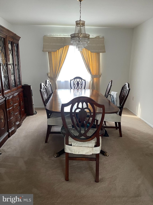 24 Elm Dr, Hightstown, NJ 08520 - dining space featuring light carpet and an inviting chandelier