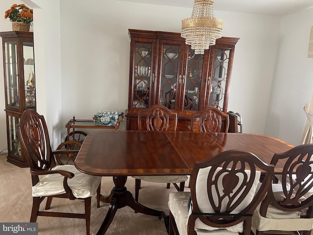 24 Elm Dr, Hightstown, NJ 08520 - dining area with a notable chandelier and carpet