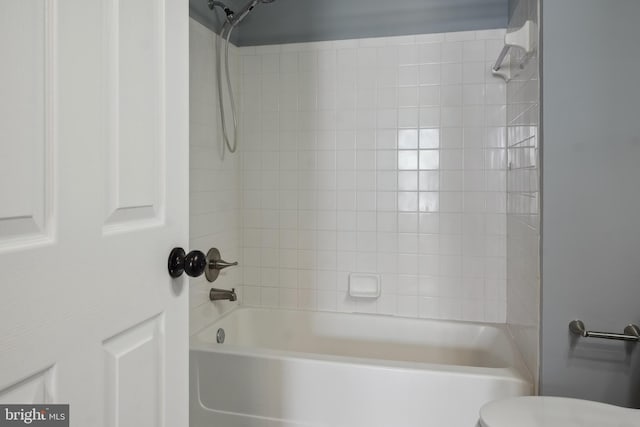 bathroom featuring toilet and shower / washtub combination
