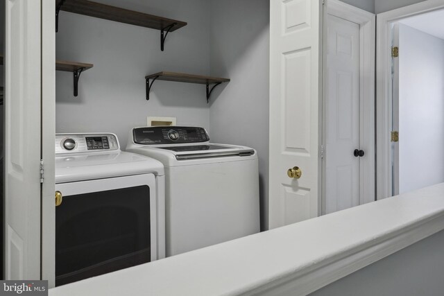 laundry room with washing machine and dryer and laundry area