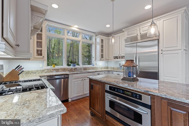 2656 Queen Anne Cir, Annapolis, MD 21403 - kitchen with stainless steel appliances, white cabinetry, a sink, and light stone counters