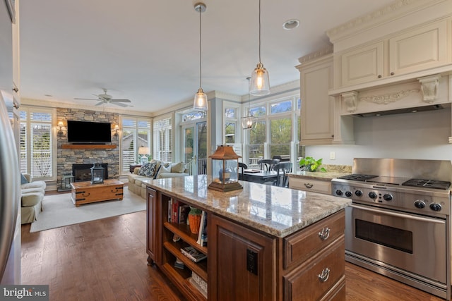 2656 Queen Anne Cir, Annapolis, MD 21403 - kitchen with a fireplace, high end range, plenty of natural light, and cream cabinets