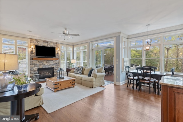 2656 Queen Anne Cir, Annapolis, MD 21403 - living room featuring baseboards, a ceiling fan, wood finished floors, and a fireplace
