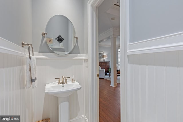 2656 Queen Anne Cir, Annapolis, MD 21403 - bathroom with a decorative wall, a wainscoted wall, wood finished floors, and a sink