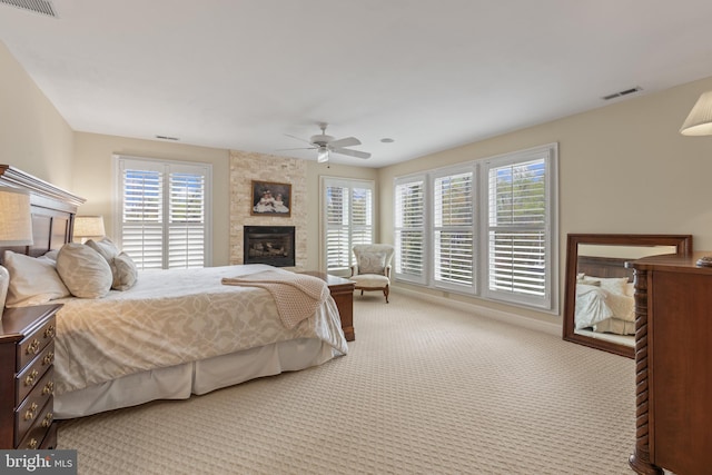 2656 Queen Anne Cir, Annapolis, MD 21403 - bedroom featuring a ceiling fan, a fireplace, carpet, and visible vents