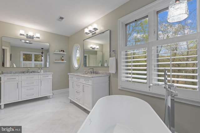 2656 Queen Anne Cir, Annapolis, MD 21403 - full bath featuring a sink, visible vents, two vanities, and a soaking tub