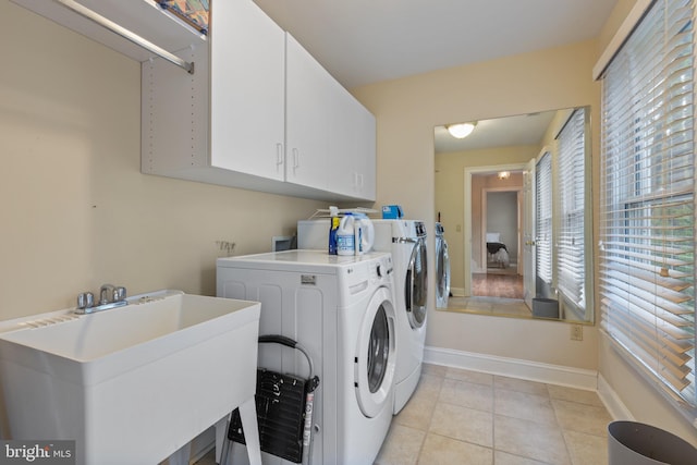 2656 Queen Anne Cir, Annapolis, MD 21403 - clothes washing area with separate washer and dryer, baseboards, light tile patterned floors, cabinet space, and a sink
