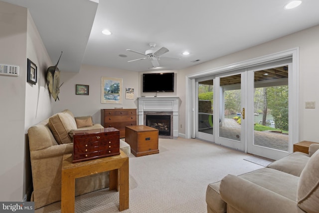 2656 Queen Anne Cir, Annapolis, MD 21403 - living room with light carpet, a high end fireplace, a ceiling fan, and recessed lighting