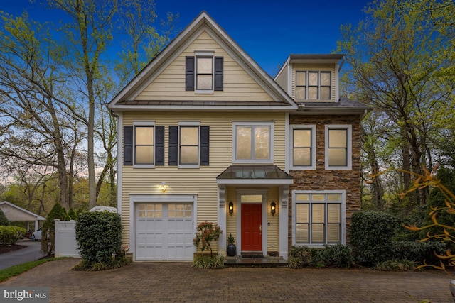 2656 Queen Anne Cir, Annapolis, MD 21403 - view of front of home with a standing seam roof, decorative driveway, metal roof, fence, and a garage