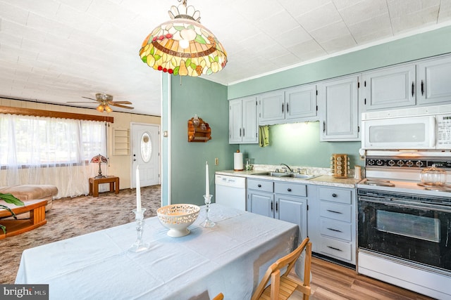 40 Dogwood Dr, Baltimore, MD 21220 - kitchen with white appliances, a ceiling fan, a sink, and light countertops