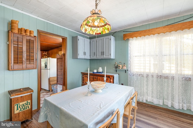 40 Dogwood Dr, Baltimore, MD 21220 - dining room with wooden walls, crown molding, and wood finished floors