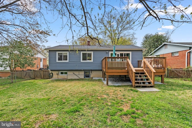 rear view of house featuring a chimney, stairway, a fenced backyard, a yard, and a deck