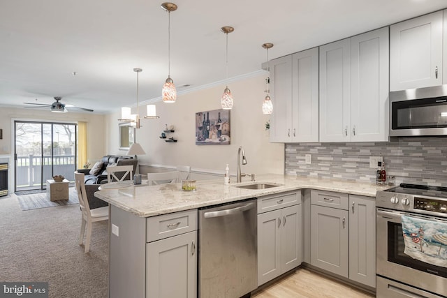 201 S Heron Dr Unit 1G, Harbour Club, Ocean City, MD 21842 - kitchen featuring gray cabinetry, a sink, a peninsula, and appliances with stainless steel finishes