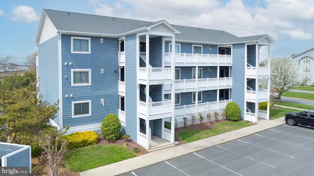 201 S Heron Dr Unit 1G, Harbour Club, Ocean City, MD 21842 - view of building exterior with uncovered parking