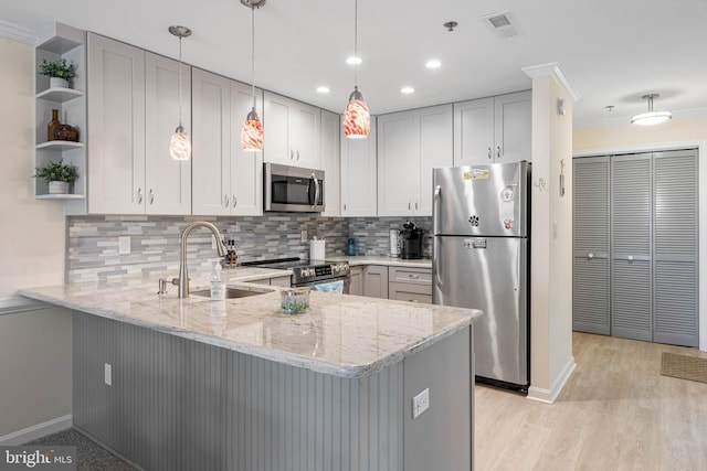 201 S Heron Dr Unit 1G, Harbour Club, Ocean City, MD 21842 - kitchen with open shelves, a sink, light stone counters, a peninsula, and appliances with stainless steel finishes