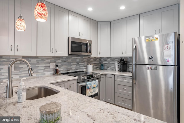 201 S Heron Dr Unit 1G, Harbour Club, Ocean City, MD 21842 - kitchen with gray cabinets, a sink, light stone countertops, appliances with stainless steel finishes, and decorative backsplash