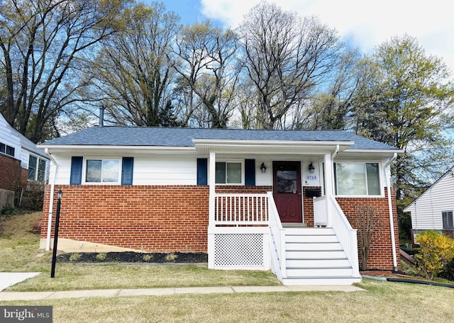 4714 Glenoak Rd, Hyattsville, MD 20784 - single story home with a porch, brick siding, a front yard, and roof with shingles