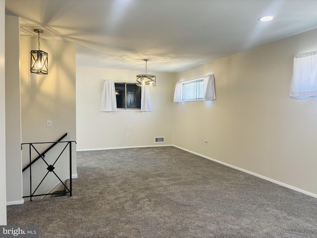 4714 Glenoak Rd, Hyattsville, MD 20784 - unfurnished room with a notable chandelier, dark colored carpet, recessed lighting, baseboards, and visible vents