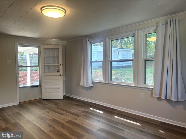 4714 Glenoak Rd, Hyattsville, MD 20784 - spare room with plenty of natural light, ornamental molding, baseboards, and dark wood-style floors