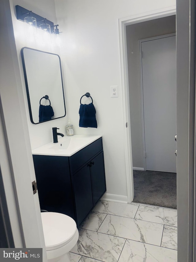 4714 Glenoak Rd, Hyattsville, MD 20784 - bathroom with toilet, baseboards, marble finish floor, and vanity
