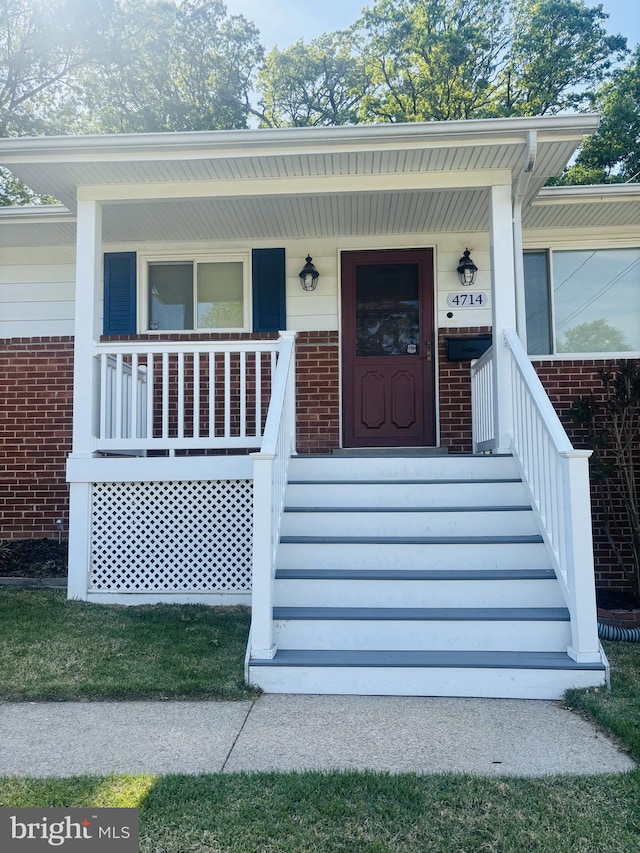 4714 Glenoak Rd, Hyattsville, MD 20784 - doorway to property with a porch and brick siding