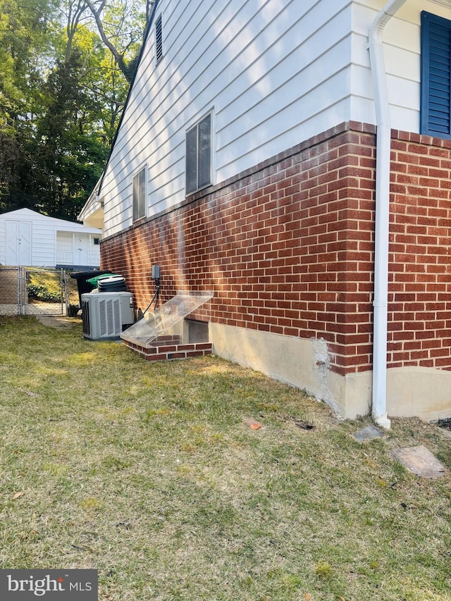 4714 Glenoak Rd, Hyattsville, MD 20784 - view of side of property with brick siding, a lawn, and central air condition unit