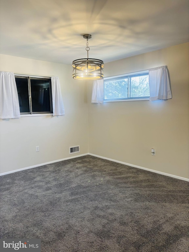 4714 Glenoak Rd, Hyattsville, MD 20784 - spare room featuring carpet floors, baseboards, and visible vents