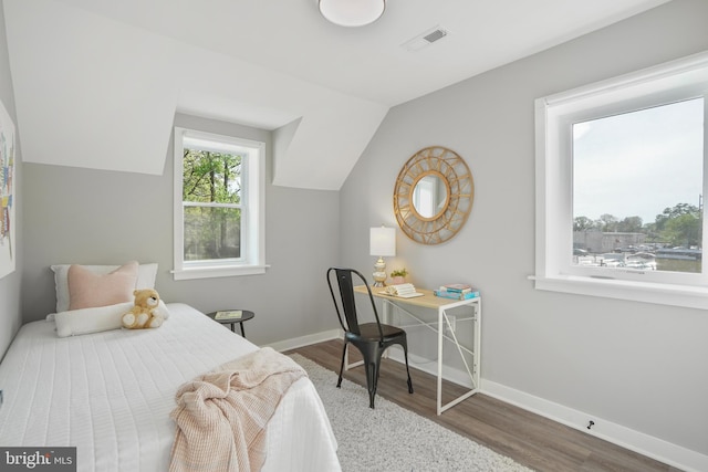 2116 R St NE, Washington, DC 20002 - bedroom featuring baseboards, lofted ceiling, wood finished floors, and visible vents