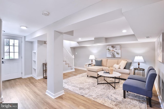 2116 R St NE, Washington, DC 20002 - living area featuring baseboards, visible vents, stairs, and light wood-style flooring