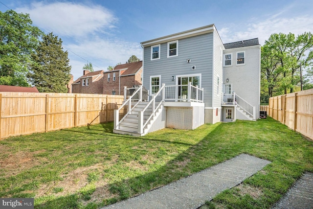2116 R St NE, Washington, DC 20002 - back of property with a wooden deck, a yard, stairway, and a fenced backyard
