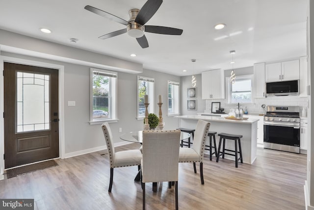 2116 R St NE, Washington, DC 20002 - dining space featuring baseboards, recessed lighting, a ceiling fan, and light wood-style flooring
