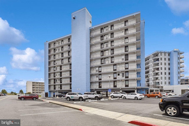 view of property with uncovered parking