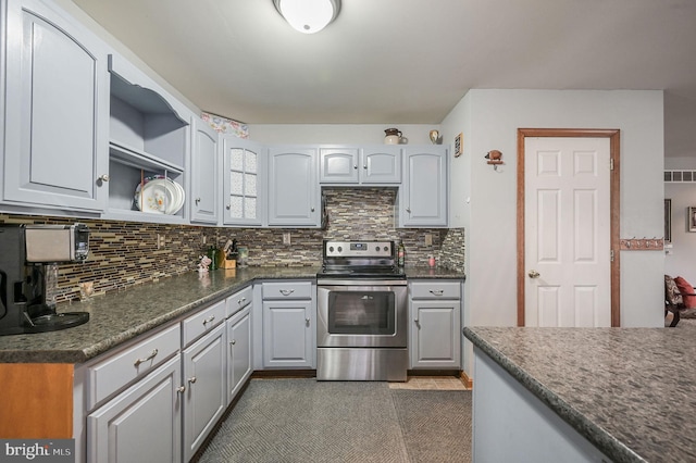 113 Fieldbrook, Magnolia, DE 19962 - kitchen with stainless steel range with electric stovetop, dark countertops, tasteful backsplash, and open shelves