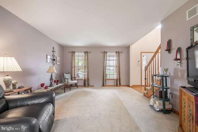 113 Fieldbrook, Magnolia, DE 19962 - living area featuring stairway, light carpet, and baseboards