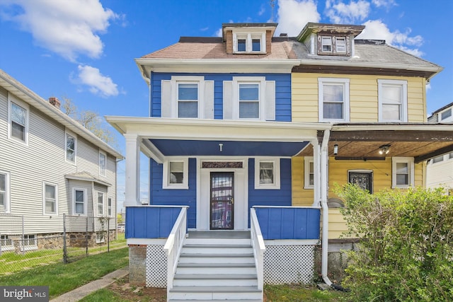4011 Hayward Ave, Baltimore, MD 21215 - view of front facade featuring a porch and fence