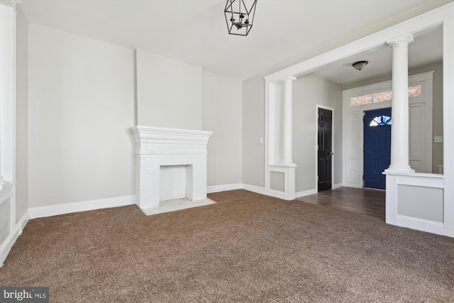 4011 Hayward Ave, Baltimore, MD 21215 - unfurnished living room with baseboards, decorative columns, and dark colored carpet